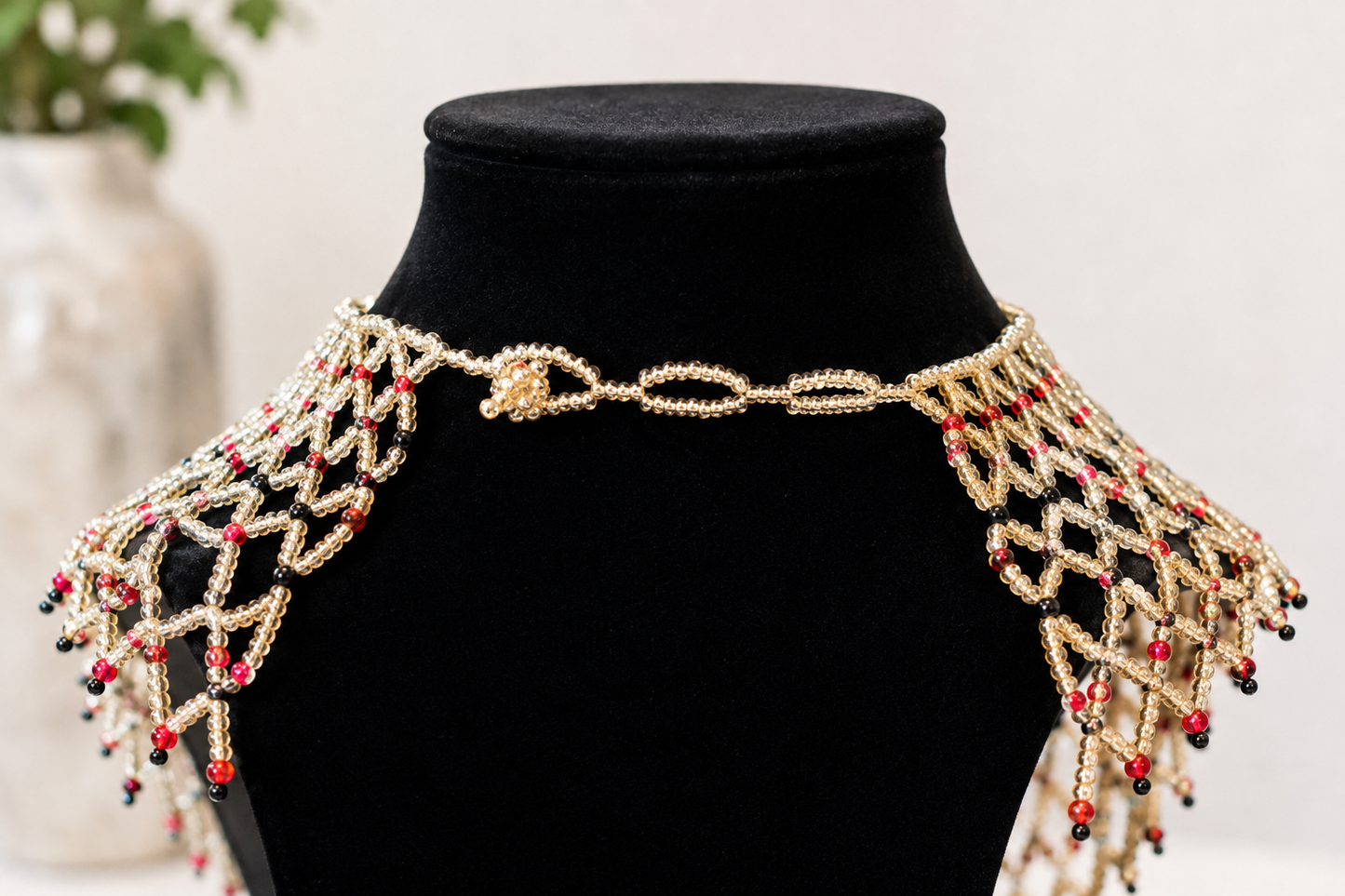 Light Brown shoulder necklace with Black and Red beads
